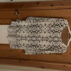 Never worn snakeskin dress.  Would look great with a black belt and boots